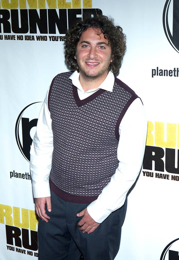 Actor Oliver Cooper arrives for the world premiere of the Twentieth Century Fox and New Regency's film "Runner Runner" at Planet Hollywood Wednesday, September 18, 2013.