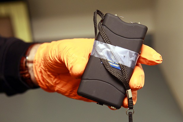 Clark County Deputy Marshal Curt Taylor holds a taser confiscated in September at the Regional Justice Center Thursday, September 19, 2013.