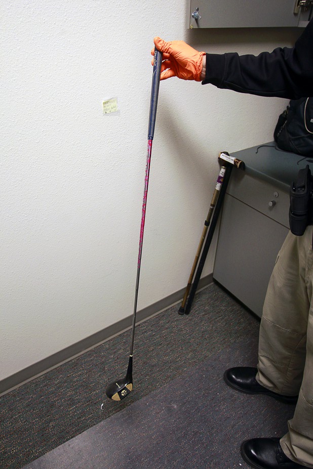 Clark County Deputy Marshal Curt Taylor holds a golf club at the Regional Justice Center Thursday, September 19, 2013.