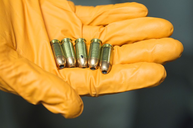 Clark County Deputy Marshal Curt Taylor shows live rounds confiscated in September at the Regional Justice Center Thursday, September 19, 2013.