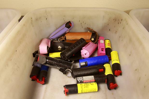 A tray holds pepper spray confiscated in September at the Regional Justice Center Thursday, September 19, 2013.