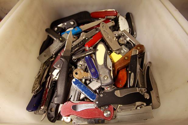 A tray holds knives confiscated in September at the Regional Justice Center Thursday, September 19, 2013.