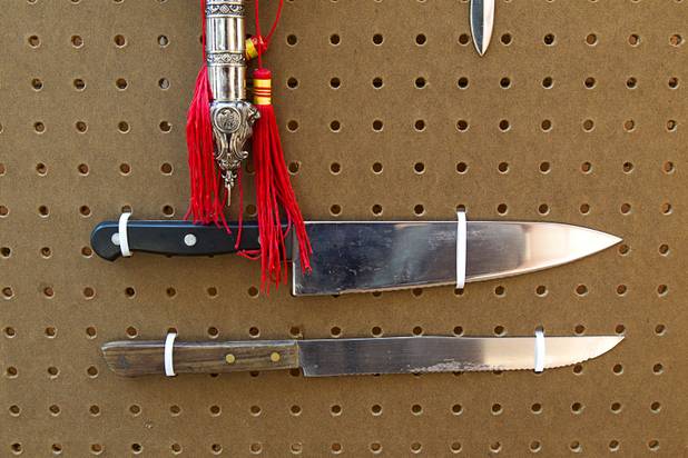 Kitchen knives are shown in a display of confiscated weapons and prohibited items at the Regional Justice Center Thursday, September 19, 2013.
