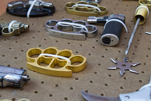Brass knuckles are shown in a display of confiscated weapons and prohibited items at the Regional Justice Center Thursday, September 19, 2013.