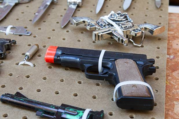 A replica handgun is shown in a display of confiscated weapons and prohibited items at the Regional Justice Center Thursday, September 19, 2013.