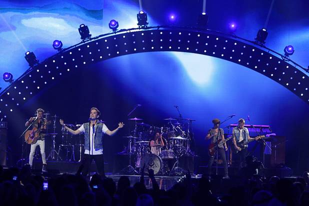Members of the band The Summer Set perform during the iHeartRadio Music Festival at the MGM Grand Garden Arena Friday, Sept. 20, 2013.