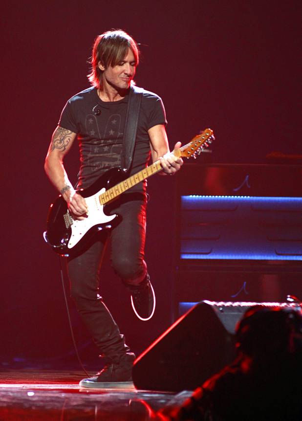 Keith Urban performs during the iHeartRadio Music Festival at the MGM Grand Garden Arena Friday, Sept. 20, 2013.