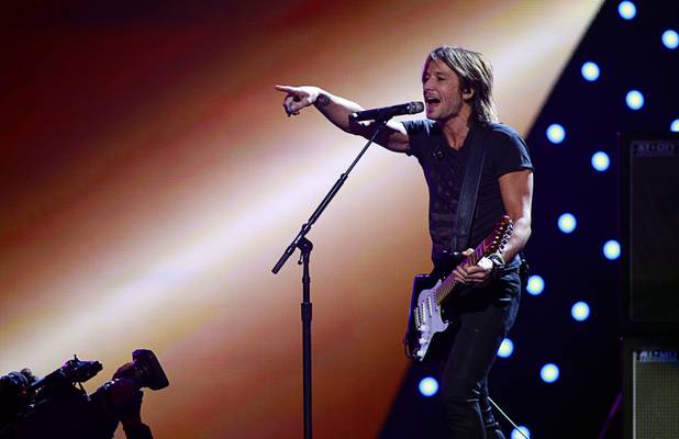 Keith Urban performs during the iHeartRadio Music Festival at MGM Grand Garden Arena on Friday, Sept. 20, 2013.