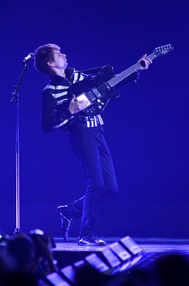 Muse lead singer and guitarist Matthew Bellamy performs during the iHeartRadio Music Festival at the MGM Grand Garden Arena Friday, Sept. 20, 2013.
