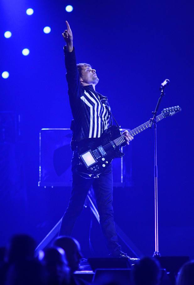 Muse lead singer and guitarist Matthew Bellamy performs during the iHeartRadio Music Festival at the MGM Grand Garden Arena Friday, Sept. 20, 2013.