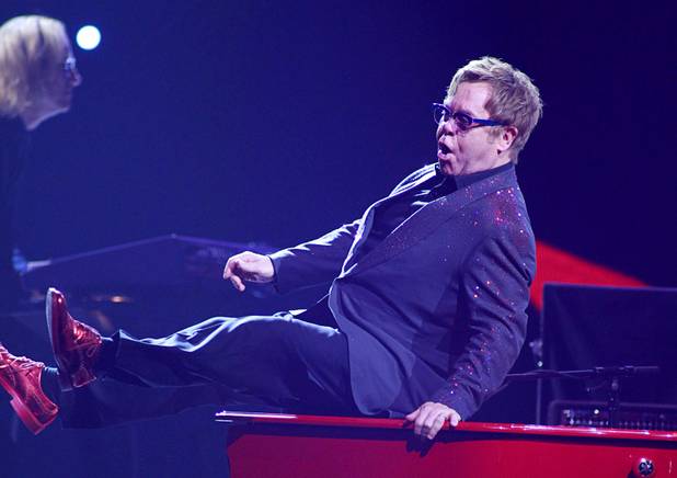 Elton John performs during the iHeartRadio Music Festival at the MGM Grand Garden Arena Friday, Sept. 20, 2013.