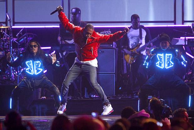 Chris Brown  performs with dancers during the iHeartRadio Music Festival at the MGM Grand Garden Arena Friday, Sept. 20, 2013.