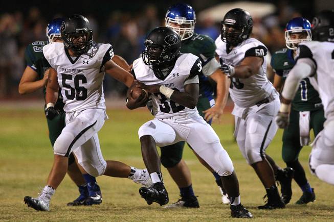 Palo Verde linebacker Chauntez Thomas runs back an interception that would help force overtime during their game against Green Valley Friday, Sept. 20, 2013. Green Valley won the game in overtime 42-41.