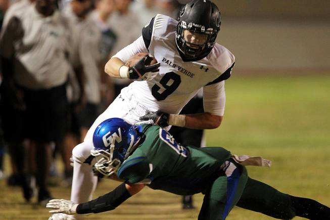 Green Valley cornerback Jacob Rivero takes down Palo Verde tight end Jake Ortale during their game Friday, Sept. 20, 2013. Green Valley won the game in overtime 42-41.