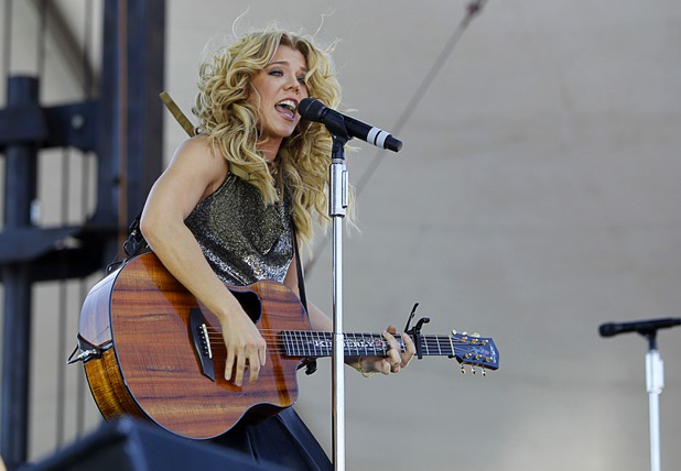 Kimberly Perry of The Band Perry performs in the Village during the iHeartRadio Music Festival Saturday, Sept. 21, 2013.