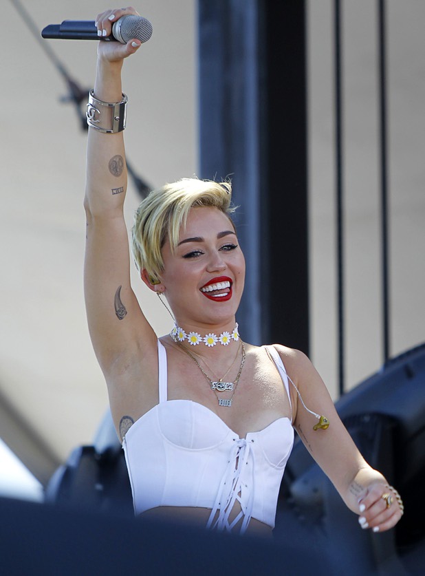 Miley Cyrus arrives for a performance in the Village during the iHeartRadio Music Festival Saturday, Sept. 21, 2013.