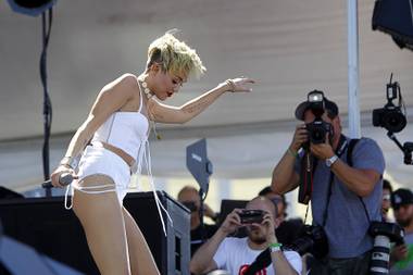 Miley Cyrus dances in the Village across from the Luxor during the 2013 iHeartRadio Music Festival on Saturday, Sept. 21,&nbsp;2013.