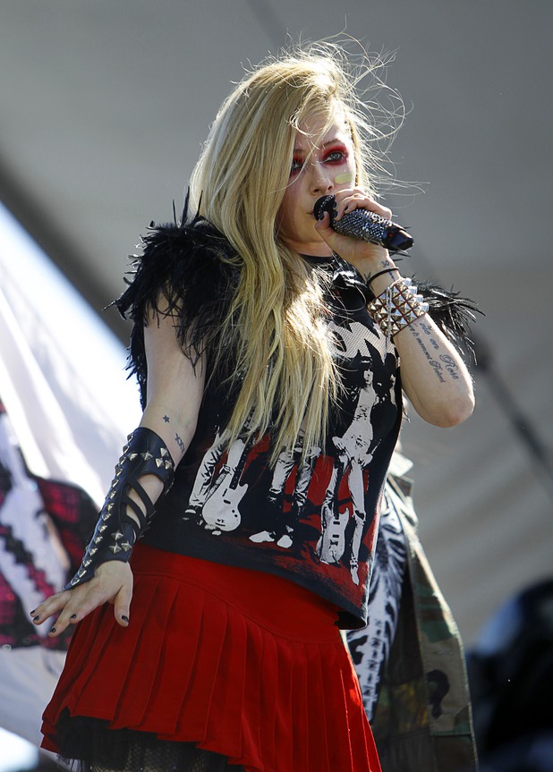 Avril Lavigne performs in the Village during the iHeartRadio Music Festival Saturday, Sept. 21, 2013.