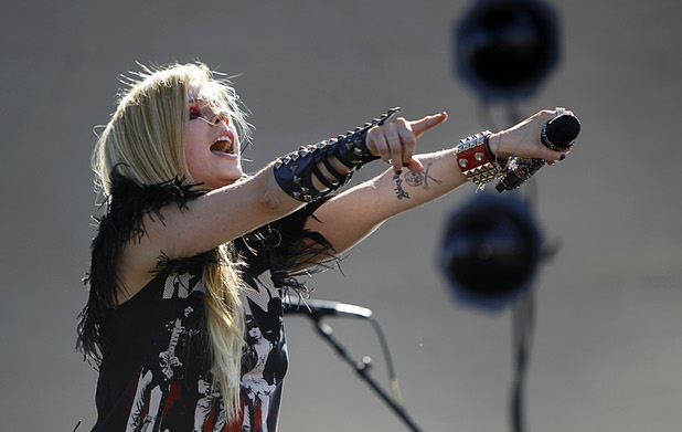 Avril Lavigne performs in the Village during the iHeartRadio Music Festival Saturday, Sept. 21, 2013.