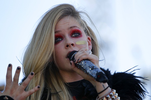Avril Lavigne performs in the Village during the iHeartRadio Music Festival Saturday, Sept. 21, 2013.