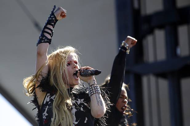 Avril Lavigne performs in the Village during the iHeartRadio Music Festival Saturday, Sept. 21, 2013.