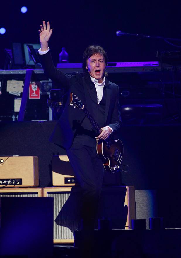 Paul McCartney arrives onstage at the iHeartRadio Music Festival in the MGM Grand Garden Arena Saturday, Sept. 21, 2013.