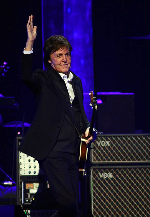 Paul McCartney arrives onstage at the iHeartRadio Music Festival in the MGM Grand Garden Arena Saturday, Sept. 21, 2013.