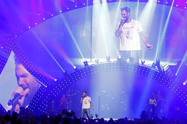 Maroon 5 lead singer Adam Levine  performs with the band during the iHeartRadio Music Festival in the MGM Grand Garden Arena Saturday, Sept. 21, 2013.