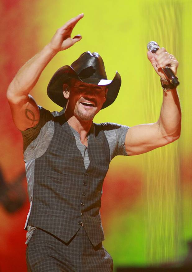 Tim McGraw (R) performs during the iHeartRadio Music Festival in the MGM Grand Garden Arena Saturday, Sept. 21, 2013.