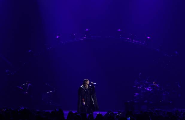 Thirty Seconds to Mars lead vocalist Jared Leto (C) performs with the band during the iHeartRadio Music Festival in the MGM Grand Garden Arena Saturday, Sept. 21, 2013.