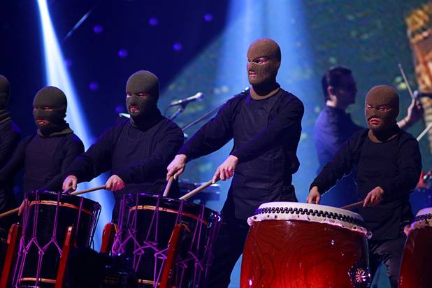 Masked drummers perform withThirty Seconds to Mars during the iHeartRadio Music Festival in the MGM Grand Garden Arena Saturday, Sept. 21, 2013.
