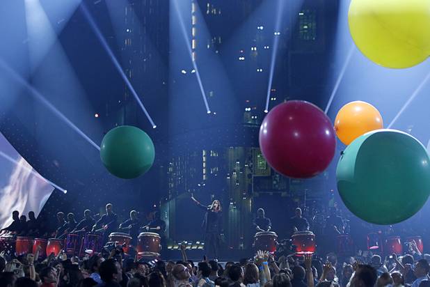 Thirty Seconds to Mars lead vocalist Jared Leto (C) performs the band during the iHeartRadio Music Festival in the MGM Grand Garden Arena Saturday, Sept. 21, 2013.
