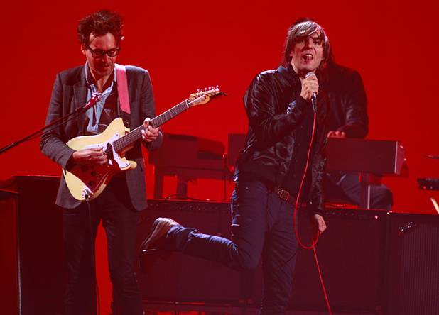 Lead singer Thomas Mars (R) performs with the French band Phoenix during the iHeartRadio Music Festival in the MGM Grand Garden Arena Saturday, Sept. 21, 2013.