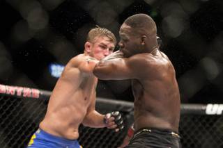 Sweden's Alexander Gustafsson (left) lands a blow on American Jon Jones during their World Light Heavyweight Championship bout during UFC 165 in Toronto on Saturday Sept. 21, 2013. (AP Photo/The Canadian Press, Chris Young)