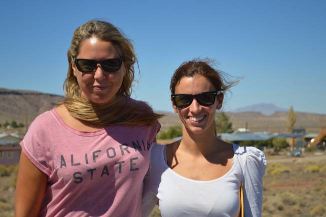 Miriam Nerecan, left, and Alba Amoros take a break while on assignment in Goldfield on Sept. 18, 2013. The pair, who now report on news in the region, moved from Spain to Tonopah when their husbands took jobs working on a solar power plant being built in the Big Smoky Valley west of town.  
