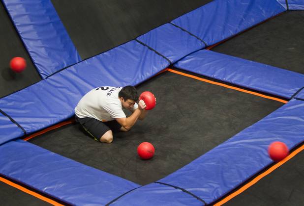 Team captain Kevin Biller of Springdale, Ohio takes cover during practice for the 2013 Ultimate Dodgeball Championship at the SkyZone Las Vegas Trampoline Park, 7440 Dean Martin Dr., Sunday, Sept. 22, 2013. Teams from the U.S. and Canada competed for their share of $50,000 of prize money. The event was filmed for later broadcast on the Fox Sports Network.