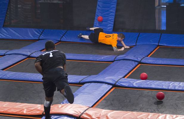 Ryan Miller of Plainfield, Ind. ducks under a ball thrown by Covina's (Calif.) Vince Marchbanks during the 2013 Ultimate Dodgeball Championship at the SkyZone Las Vegas Trampoline Park, 7440 Dean Martin Dr., Sunday, Sept. 22, 2013. Teams from the U.S. and Canada competed for their share of $50,000 of prize money. The event was filmed for later broadcast on the Fox Sports Network.