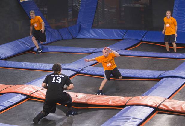 Covina's Ish Blano beats Plainfield's Wade Norton to a ball during the 2013 Ultimate Dodgeball Championship at the SkyZone Las Vegas Trampoline Park, 7440 Dean Martin Dr., Sunday, Sept. 22, 2013. Teams from the U.S. and Canada competed for their share of $50,000 of prize money. The event was filmed for later broadcast on the Fox Sports Network.