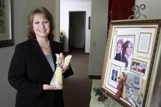 Allison Copening, founder and CEO of Seasons Funeral Planning Services, poses in the company offices Monday, Sept. 23, 2013. The service primarily assists individuals and families with decisions related to managing funerals. Copening is a former Nevada state senator.