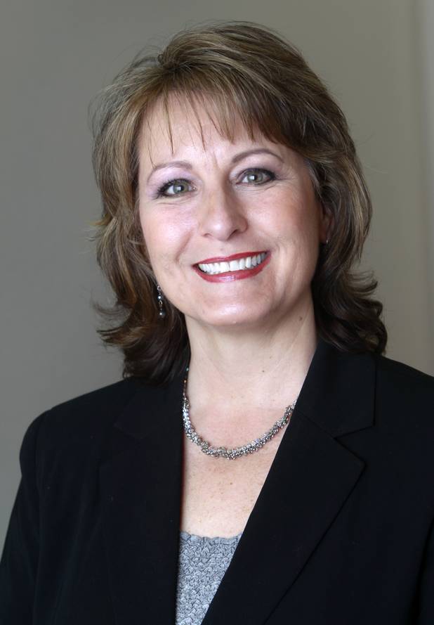 Allison Copening, founder and CEO of Seasons Funeral Planning Services, poses in the company offices Monday, Sept. 23, 2013. The service primarily assists individuals and families with decisions related to managing funerals. Copening is a former Nevada state senator.