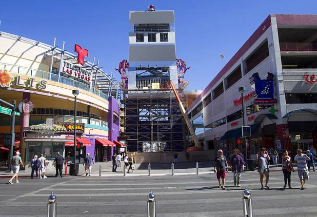 A view of the SlotZilla zipline under construction in downtown Las Vegas Monday, Sept. 23, 2013. There will be a lower zipline and an upper "zoomline." The zoomline will span the length of the Fremont Street Experience canopy. The take-off tower is an 128-foot tall, 12-story slot machine-themed platform. The $11.5 million attraction is expected to open later this year.