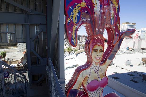 A view of the SlotZilla zipline under construction in downtown Las Vegas Monday, Sept. 23, 2013. The showgirl on the north side is based on real-life showgirl Porsha Revesz. The take-off tower is an 128-foot tall, 12-story slot machine-themed platform. The $11.5 million attraction is expected to open later this year.