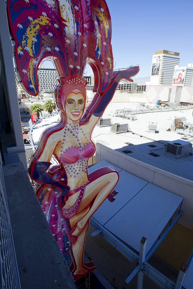 A view of the SlotZilla zipline under construction in downtown Las Vegas Monday, Sept. 23, 2013. The 38-foot-tall showgirl on the north side is based on real-life showgirl Porsha Revesz. The take-off tower is an 128-foot tall, 12-story slot machine-themed platform. The $11.5 million attraction is expected to open later this year.
