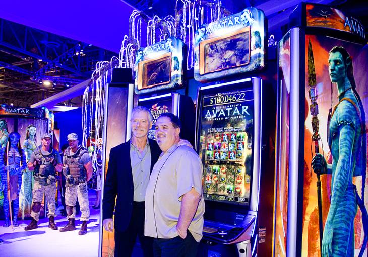 Actor Stephen Lang, left, and movie producer Jon Landau pose by "Avatar"-themed video slot machines by International Game Technology (IGT) during the G2E convention at the Sands Expo Center Tuesday, Sept. 24, 2013. Landau was producer of the 2009 Avatar movie and Lang played Colonel Miles Quaritch in the film.