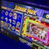 A movie clip plays on a "Jurassic Park"-themed video slot machine by International Game Technology (IGT)during the G2E convention at the Sands Expo Center Tuesday, Sept. 24, 2013.