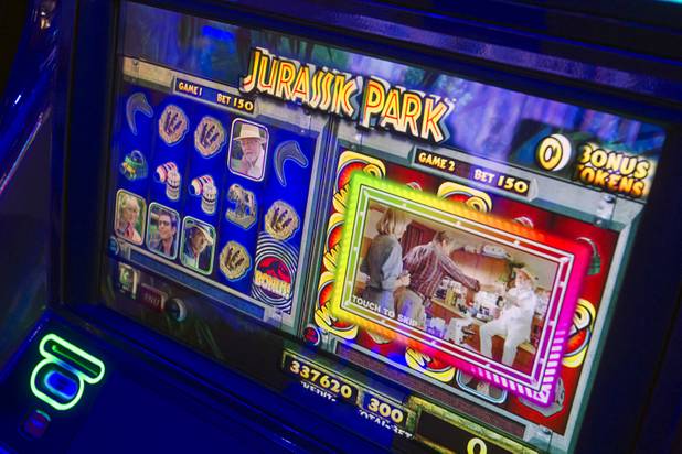 A movie clip plays on a "Jurassic Park"-themed video slot machine by International Game Technology (IGT)during the G2E convention at the Sands Expo Center Tuesday, Sept. 24, 2013.