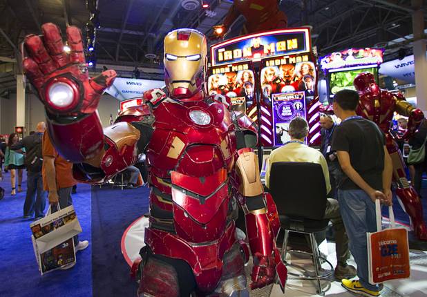 A man models an Ironman costume by Ironman-themed video slot machines by WMS Gaming during the G2E convention at the Sands Expo Center Tuesday, Sept. 24, 2013. The slots are themed after the recent Ironman movies starring Robert Downey Jr.