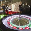 Glyn Thomas, editor of Casino Life magazine, putts a golf ball into a roulette wheel during the G2E convention at Sands Expo Center on Tuesday, Sept. 24, 2013. The game was a booth promotion by Interblock, a developer of multiplayer gaming machines.