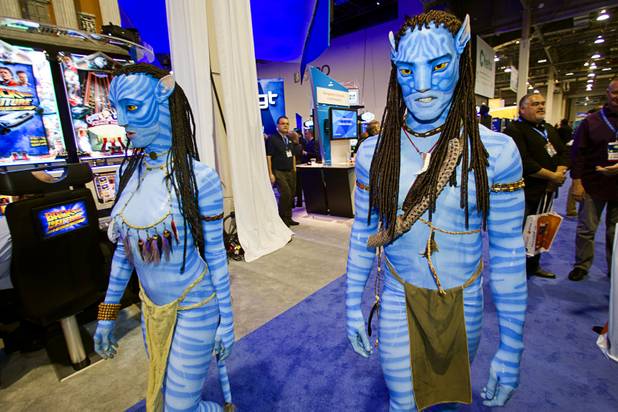 Models dressed as Na'vi warriors from the movie "Avatar" walk the convention floor during the G2E convention at the Sands Expo Center Tuesday, Sept. 24, 2013.  The warriors were promoting the new Avatar-themed video slot machines by International Game Technology (IGT).