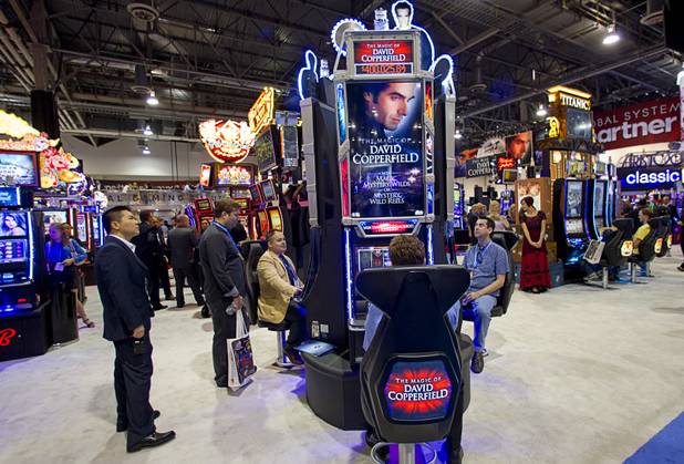 Video slot machines themed after the magic of David Copperfield are displayed during the G2E convention at the Sands Expo Center Tuesday, Sept. 24, 2013.